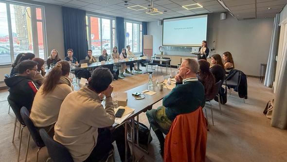 Doctoral candidates taking part in interactive training sessions focused on research methods, ethics, and scientific communicati